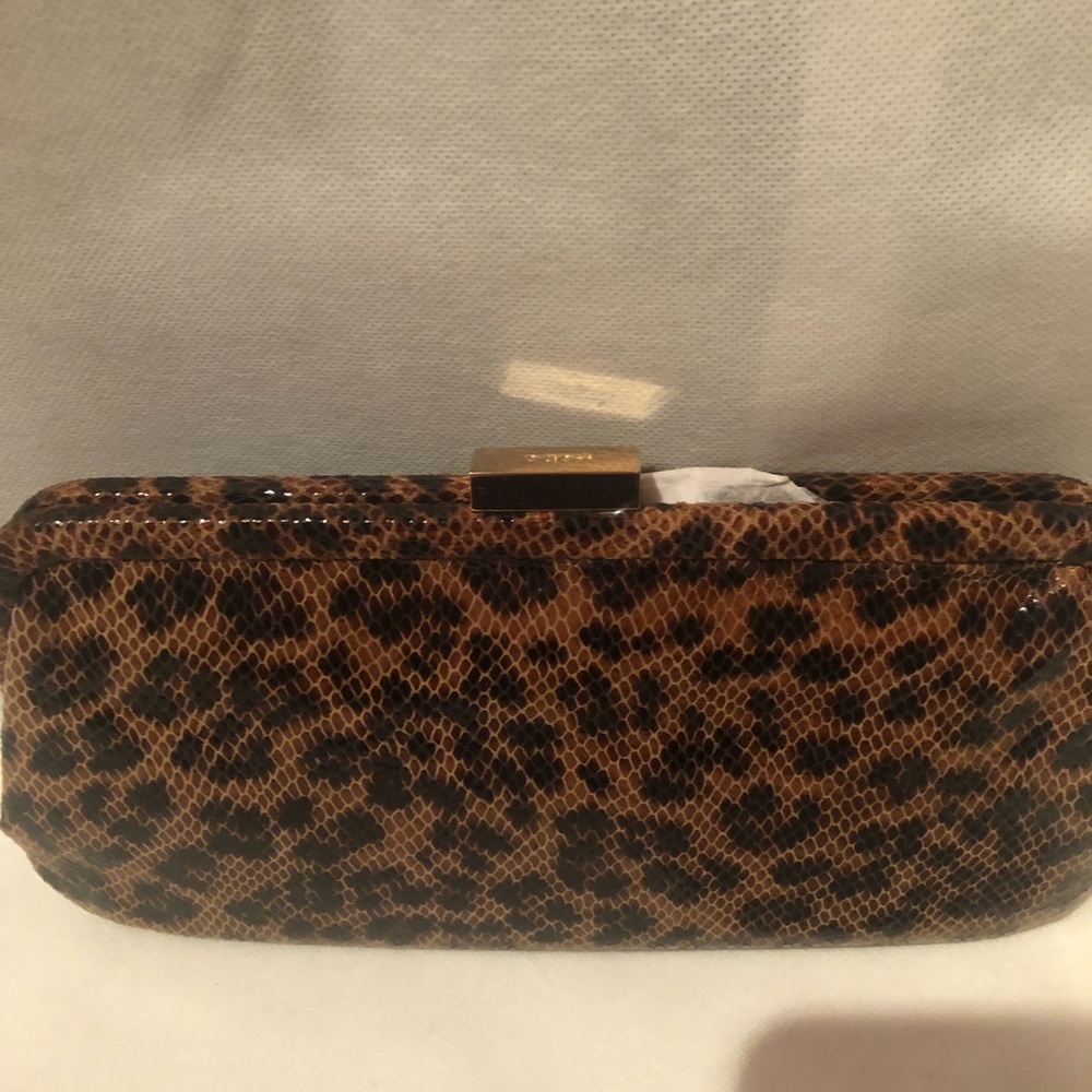 NWT designed exclusively for Bloomingdales HOBO animal print pat leather clutch.